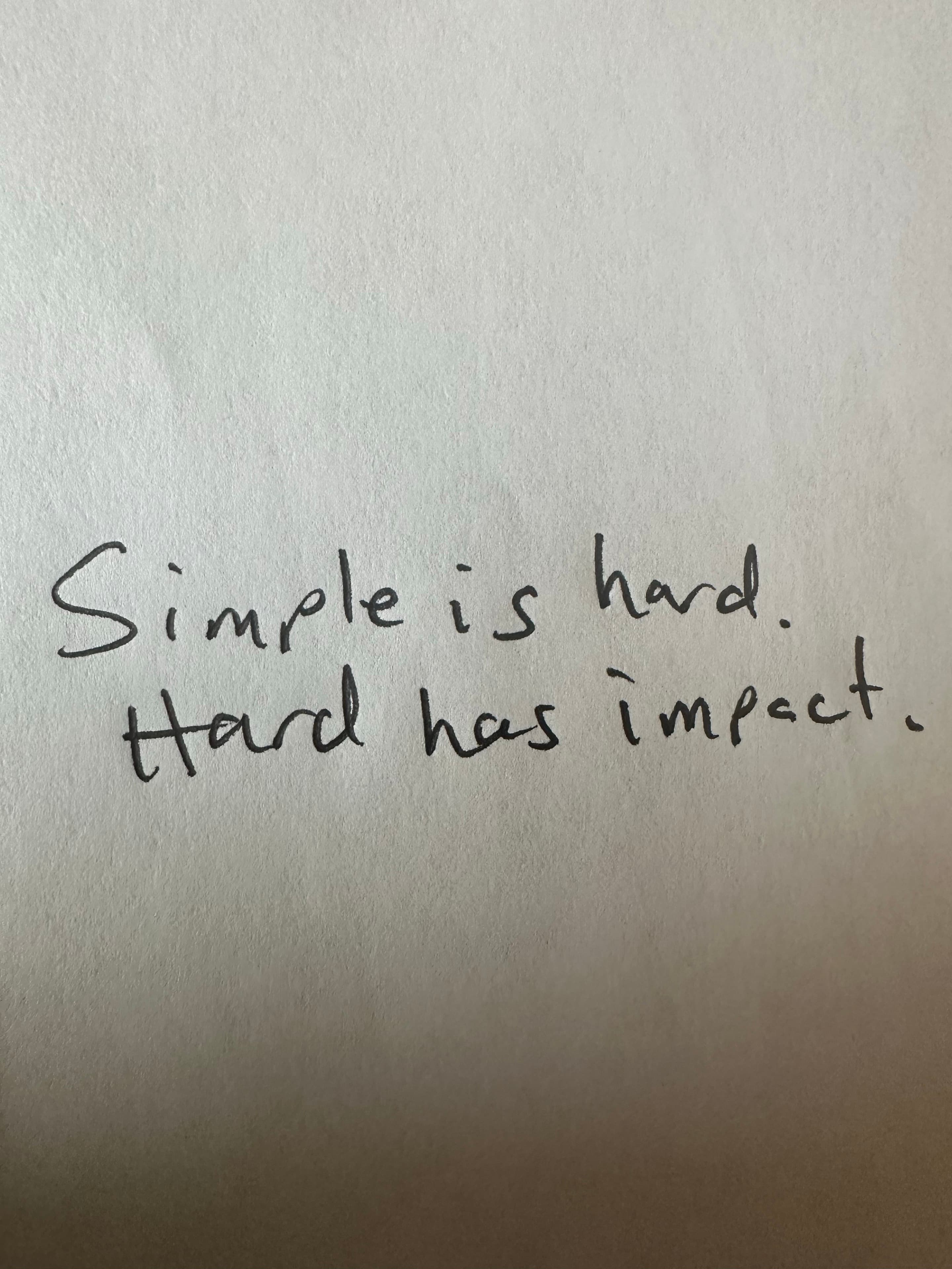 Handwritten note: Simple is hard. Hard has impact.