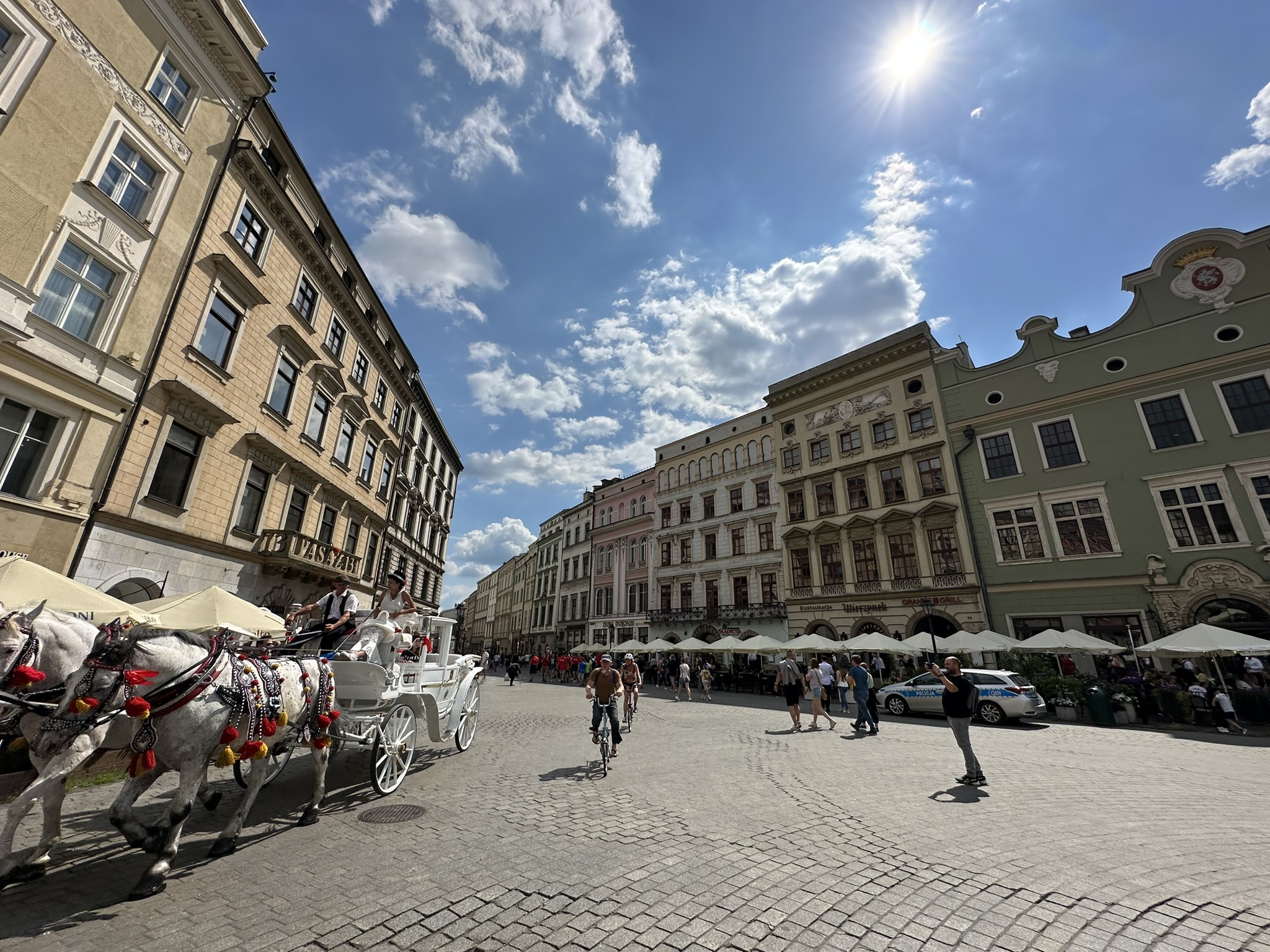 A Polish city square beneath a wide blue sky